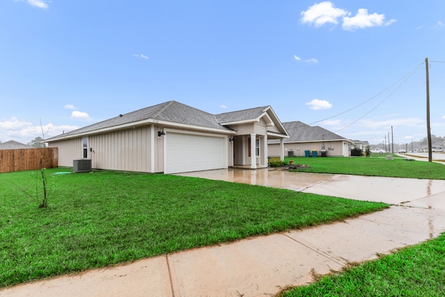 view of front of house featuring a garage and a front yard