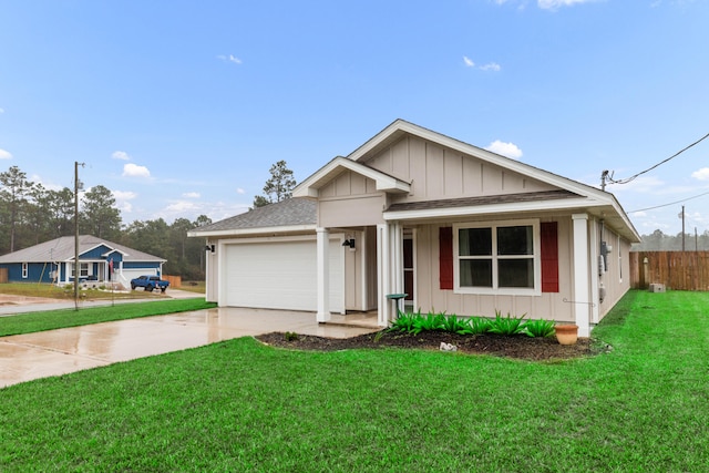 view of front facade with a garage and a front yard