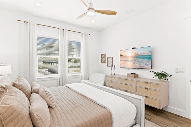 bedroom featuring hardwood / wood-style flooring and ceiling fan