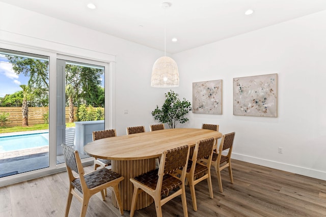 dining space featuring hardwood / wood-style flooring