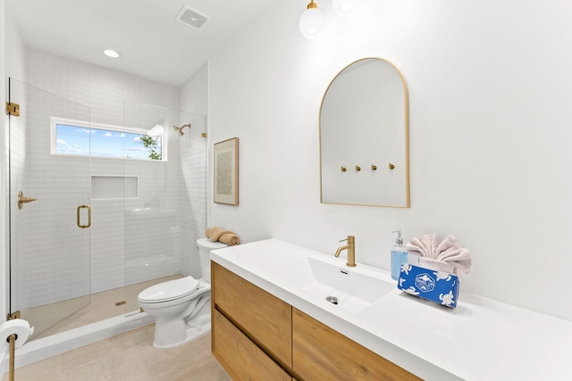 bathroom with toilet, an enclosed shower, vanity, and tile patterned flooring