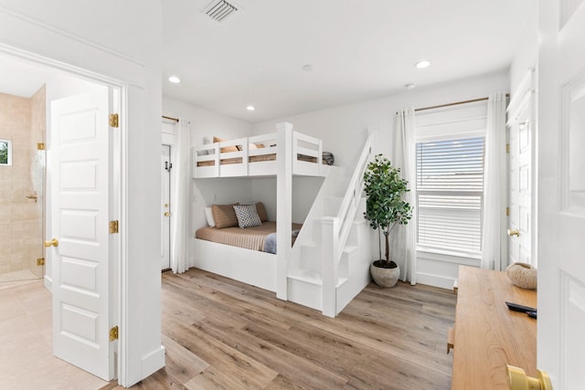 bedroom featuring light hardwood / wood-style floors