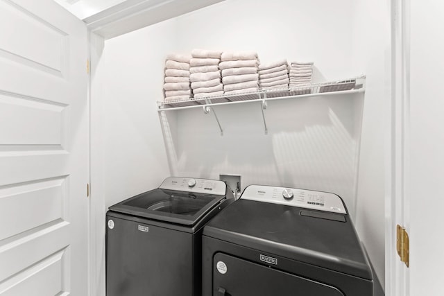 laundry room featuring washer and clothes dryer