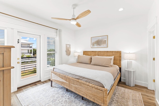 bedroom featuring access to outside, ceiling fan, and light wood-type flooring