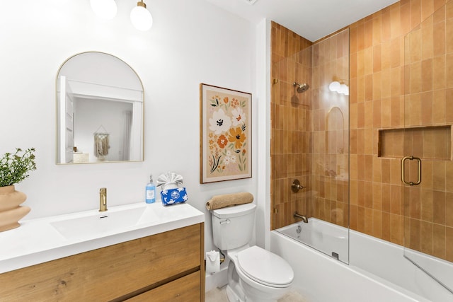 full bathroom with toilet, vanity, and shower / bath combination with glass door