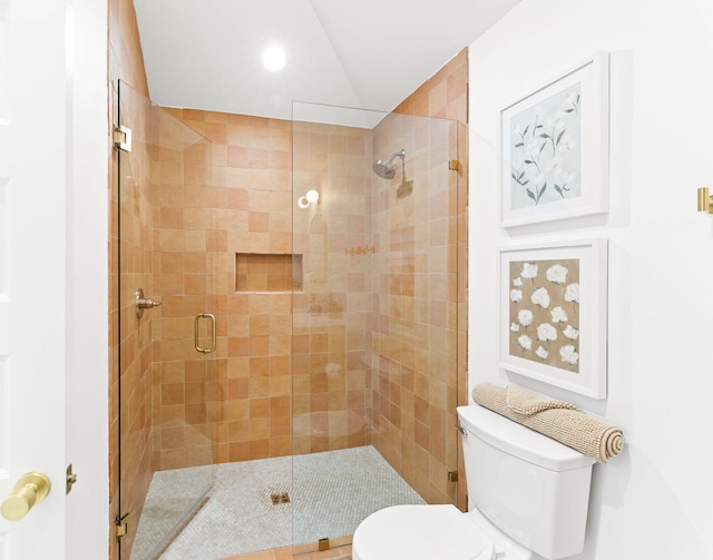 bathroom with walk in shower and toilet