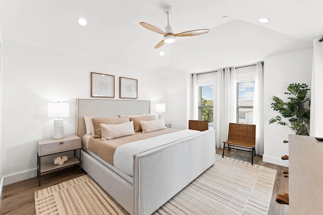 bedroom with lofted ceiling, hardwood / wood-style floors, and ceiling fan