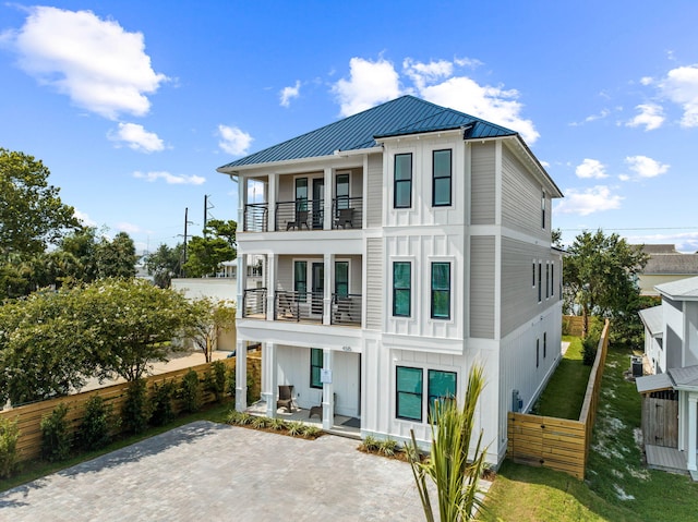 exterior space with a lawn and a balcony