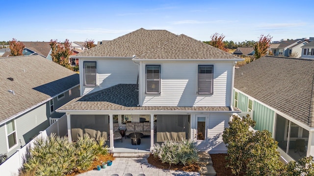 back of house with a patio