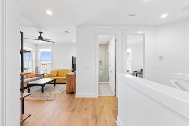 interior space with hardwood / wood-style floors and ceiling fan