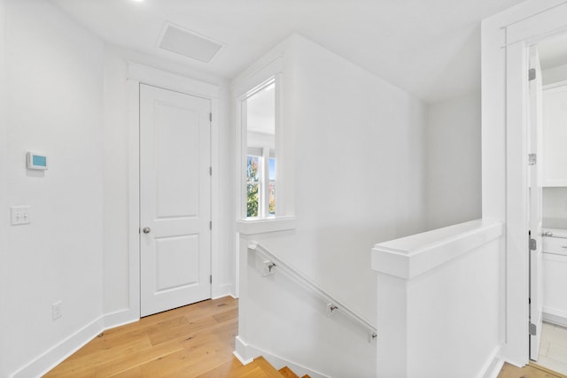 hall with light hardwood / wood-style flooring