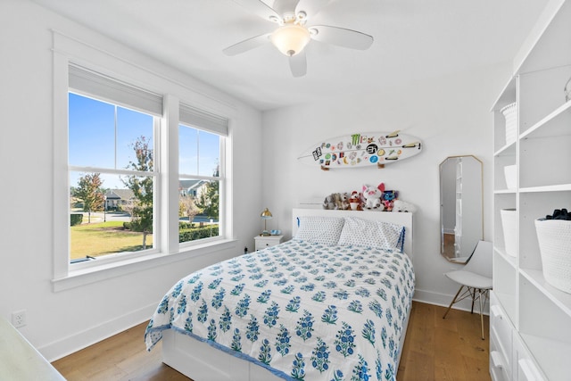 bedroom featuring hardwood / wood-style flooring and ceiling fan