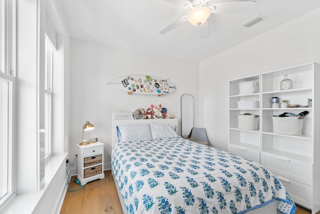 bedroom featuring light hardwood / wood-style floors and ceiling fan