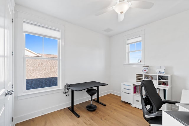 office area with ceiling fan and light hardwood / wood-style flooring