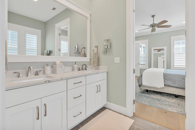 bathroom featuring vanity, hardwood / wood-style flooring, and ceiling fan