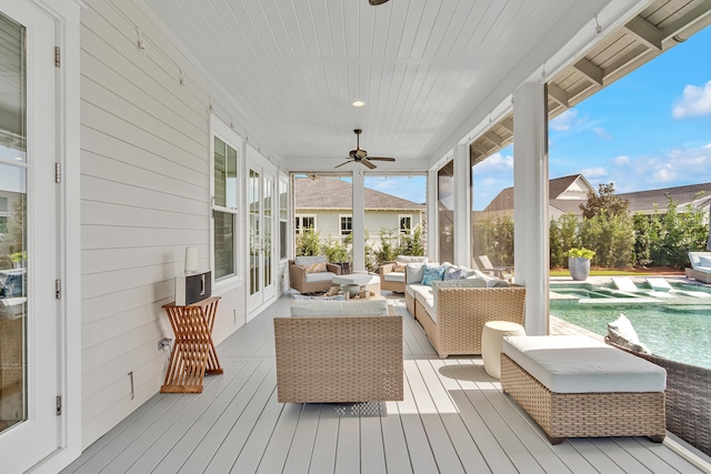 wooden terrace featuring outdoor lounge area, french doors, and ceiling fan