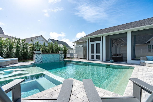 view of swimming pool with an in ground hot tub and a patio