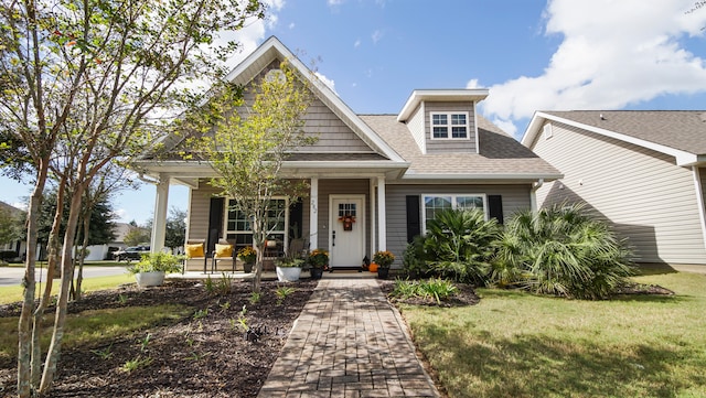 view of front of house featuring a porch and a front yard