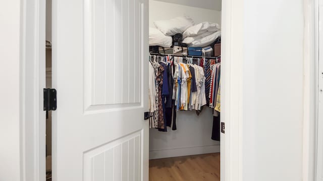 walk in closet featuring hardwood / wood-style floors