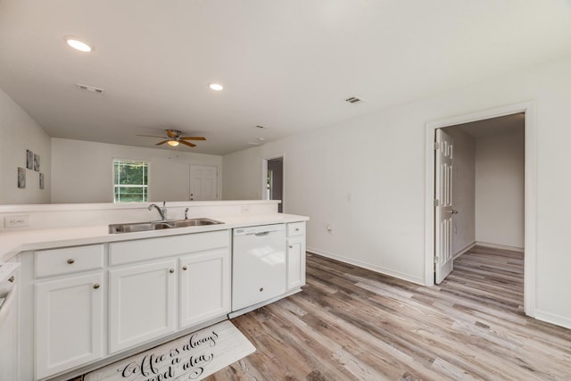 kitchen with sink, white dishwasher, white cabinetry, ceiling fan, and light hardwood / wood-style flooring