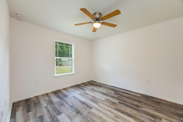 spare room with wood-type flooring and ceiling fan