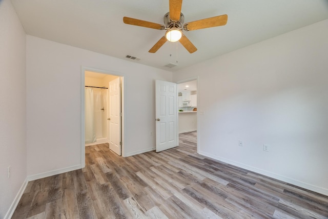 unfurnished bedroom with hardwood / wood-style floors and ceiling fan