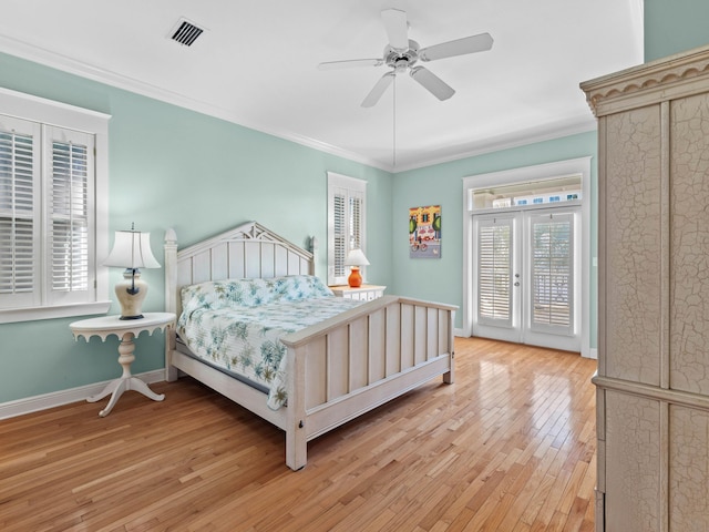 bedroom featuring ceiling fan, access to outside, light hardwood / wood-style flooring, ornamental molding, and french doors