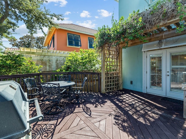 wooden deck featuring grilling area