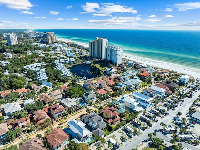 bird's eye view featuring a water view and a view of the beach