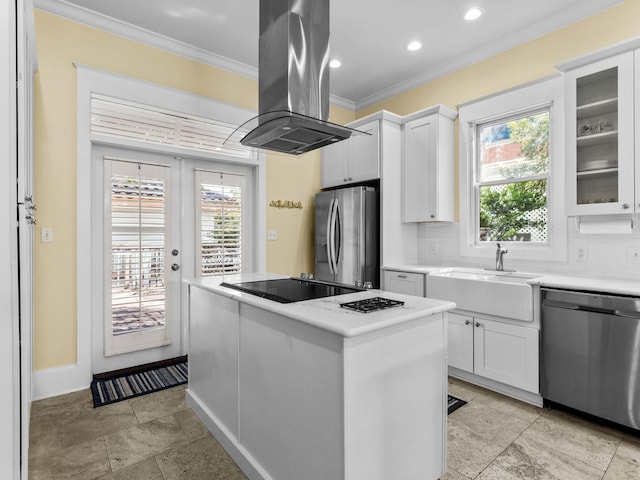 kitchen featuring white cabinetry, stainless steel appliances, and island range hood