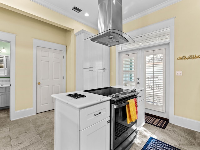 kitchen with white cabinetry, crown molding, stainless steel electric range oven, and island range hood