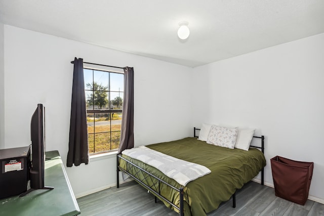 bedroom featuring wood-type flooring