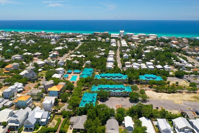 drone / aerial view featuring a water view and a residential view