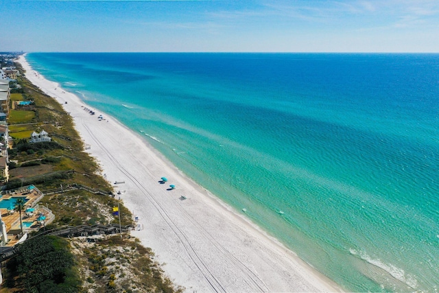 birds eye view of property with a beach view and a water view