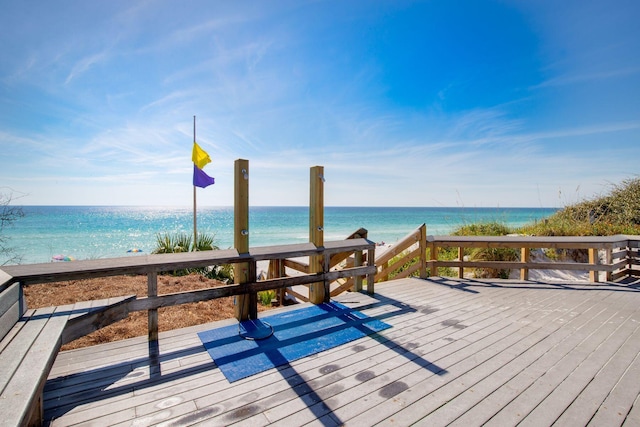 wooden deck featuring a water view