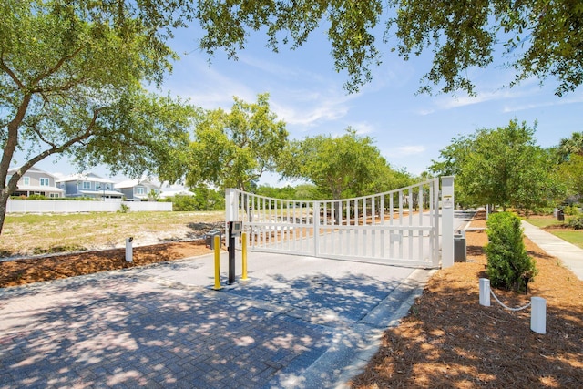 view of gate with fence