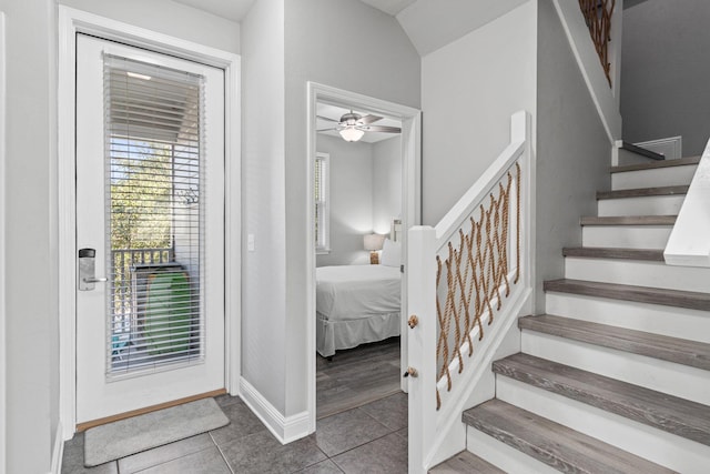 stairs with tile patterned flooring and baseboards