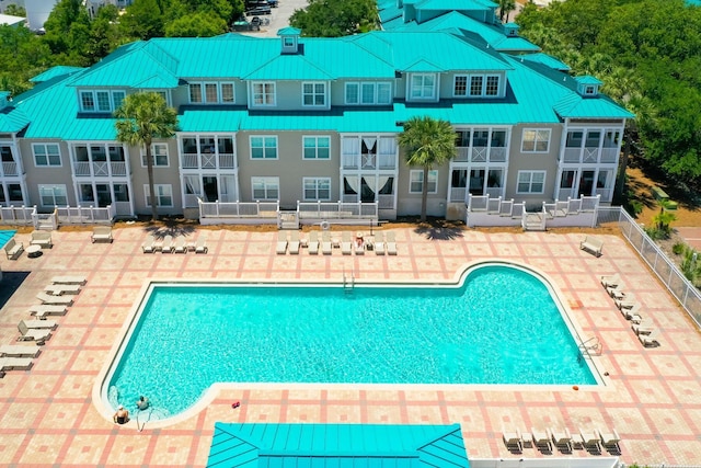 pool featuring a patio and fence