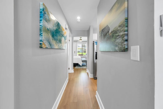 hall with light hardwood / wood-style flooring