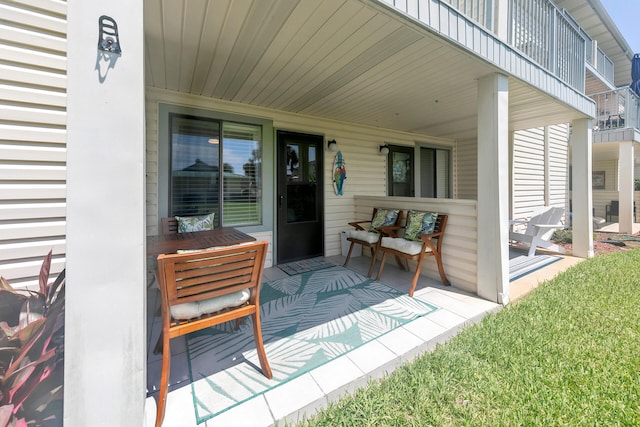 view of patio / terrace with covered porch and a balcony