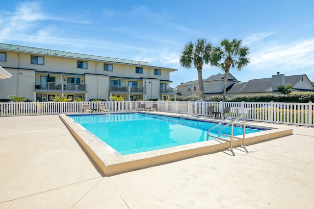 view of pool featuring a patio