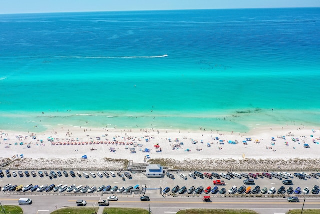 birds eye view of property featuring a view of the beach and a water view