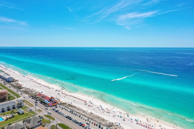 bird's eye view featuring a view of the beach and a water view