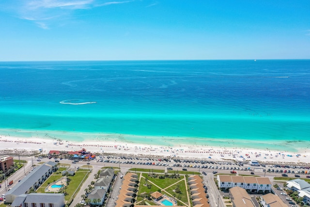 drone / aerial view featuring a view of the beach and a water view