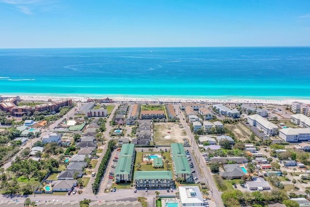 drone / aerial view with a water view and a view of the beach