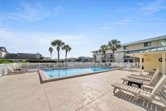 view of swimming pool with a patio area