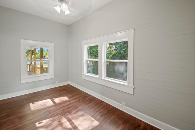 spare room featuring wood-type flooring and ceiling fan