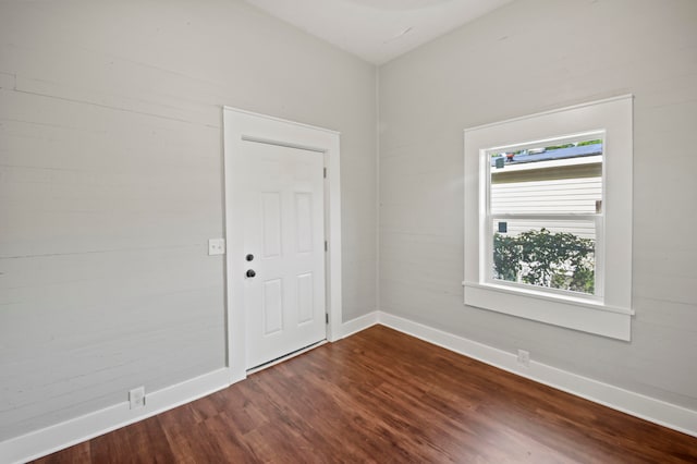 unfurnished room featuring hardwood / wood-style flooring