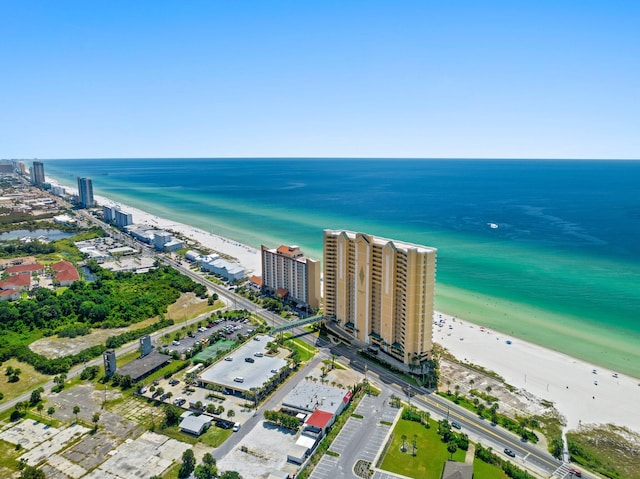 aerial view with a water view and a view of the beach