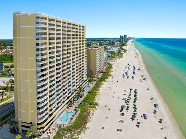 birds eye view of property featuring a view of the beach and a water view